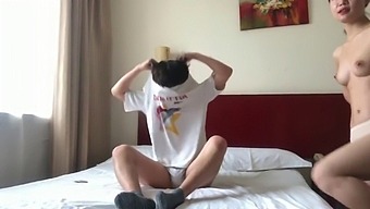 A Pair Of Chinese Lovers Share A Steamy Encounter In A Hotel Room